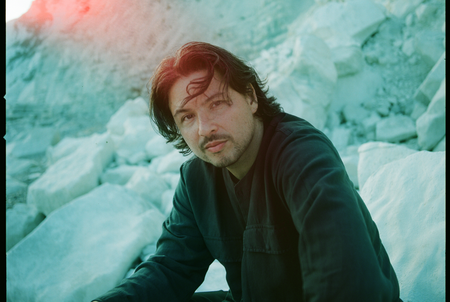 Musician Jamie Moon sitting outside